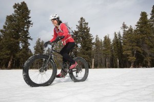 Woman Fat Biking in the Snow