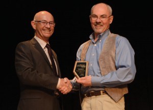 Mayor Richard Ireland presents Chris Garnham an award 