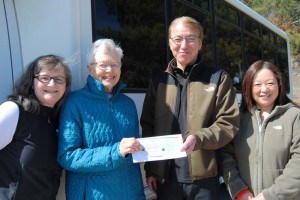 Oka sushi chef Tatsuhiko Okazaki and his wife, Rieko (right), present a cheque to Glenda Cornforth (in blue), president of the Jasper Senior’s Society.  JoAnn Black (left), a long time employee was also present. 