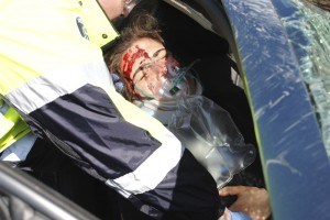 A female passenger was stabilized by paramedics during the mock driving and driving accident. Photo - P. Clarke 