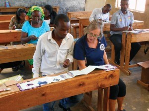 Libby Weir working with a teacher to make book - Photo provided