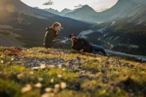 Young couple lying down at viewpoint at Parkers Ridge