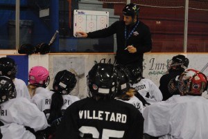 Young hockey players listen attentively during an afternoon session at the Jasper Hockey Camp. This year the camp is celebrating its 20th anniversary. Photo - P. Clarke.