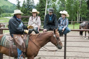 Master horseman Larry Nelles teaches three children about true horsemanship. From left to right is Payton Hallock, Braiden Hallock and Martin Hallock. Photo provided.