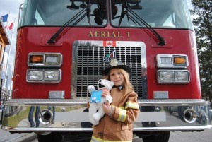 Mackenzie Byatt, 6, spent the day as Jasper's Fire Chief and made a new friend along the way, Sparky the polar bear. Photo - P. Clarke