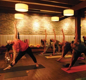 About a dozen people attended a free yoga session and raised nearly $600, Nov. 14 to help a Syrian refugee family that will soon arrive in Jasper. Photo - P. Clarke.