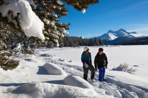 A couple snowshoes on the shore of Maligne Lake
