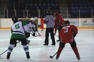 Trenton Rea lines up for the faceoff. Photo - Yaqing Yang.