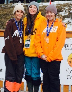 Cora Laidlaw (centre) won gold in the mogul competition for girls under 16. Photo submitted.