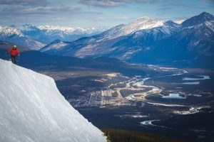 a young man downhill skies at Marmot Basin