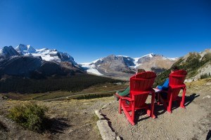 Parks Canada's red chair program has proven extremely popular. Here two hikers take a rest while hiking Wilcox Pass. Parks Canada/Ryan Bray. 