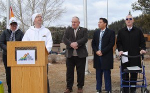 Uwe Walter (in white) addressed a crowd during the official flag raising ceremony during the Jasper Pride Festival this year. P. Clarke photo