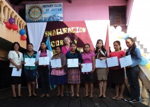 Donnelly Hart stands with some of her sewing students as they receive their certificates. Submitted photo