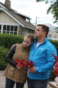 Many in attendance comforted each other during the sombre event. Photo - K., Byrne. 