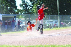 Elvis Gorontzy-Slack slides into home during the provincial tier one championships in Clive, Alta. Submitted photo
