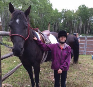 Athena Urie is one of the children that participate in the weekly therapy rides. Photo submitted. 
