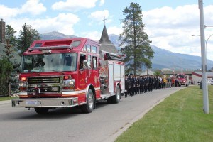 Dozens of firefighters, police officers and first responders marched shoulder-to-shoulder to honour Reuben Doyle, a volunteer firefighter who took his own life, Aug. 6. P. Clarke photo. 