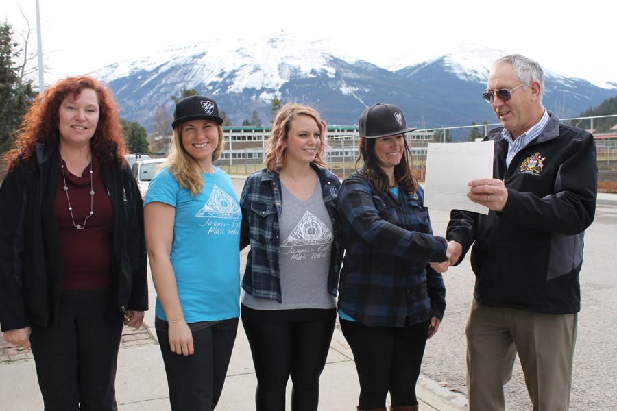 Folk fest organizers were delighted to receive a $31,600 grant, Oct. 26.  Pictured left to right: West Yellowhead constituency manager Kathleen Westergaard, Anna Faris, Cara Zazelenchuk, Cristin Murphy and West Yellowhead MLA Eric Rosendahl. K. Byrne photo. 