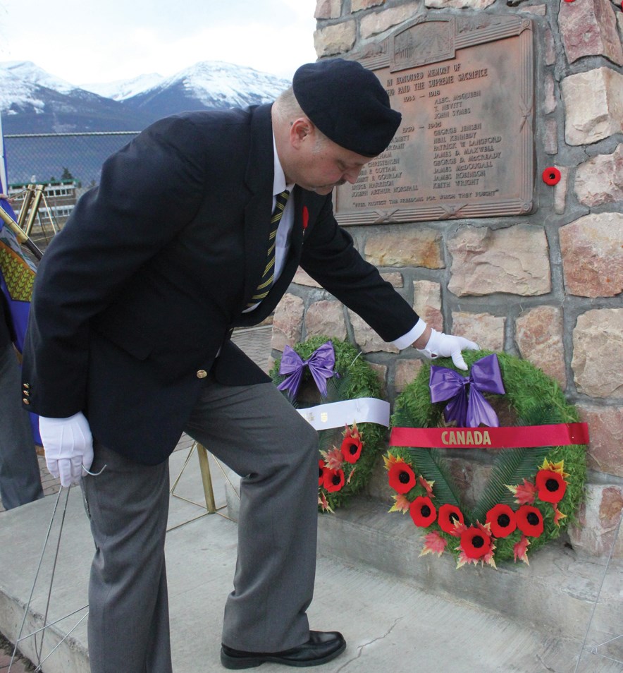 Ken Kuzminski, the president of the legion, lays a wreath at the Jasper Cenotaph, Nov. 11, 2016. K. Byrne photo. 