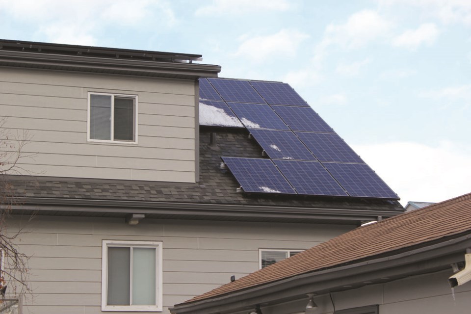 Gridworks Energy Group recently installed 32 photovoltaic solar panels on Candice Davis and Mike Horvath’s roof on Patricia Street. P. Clarke photo. 