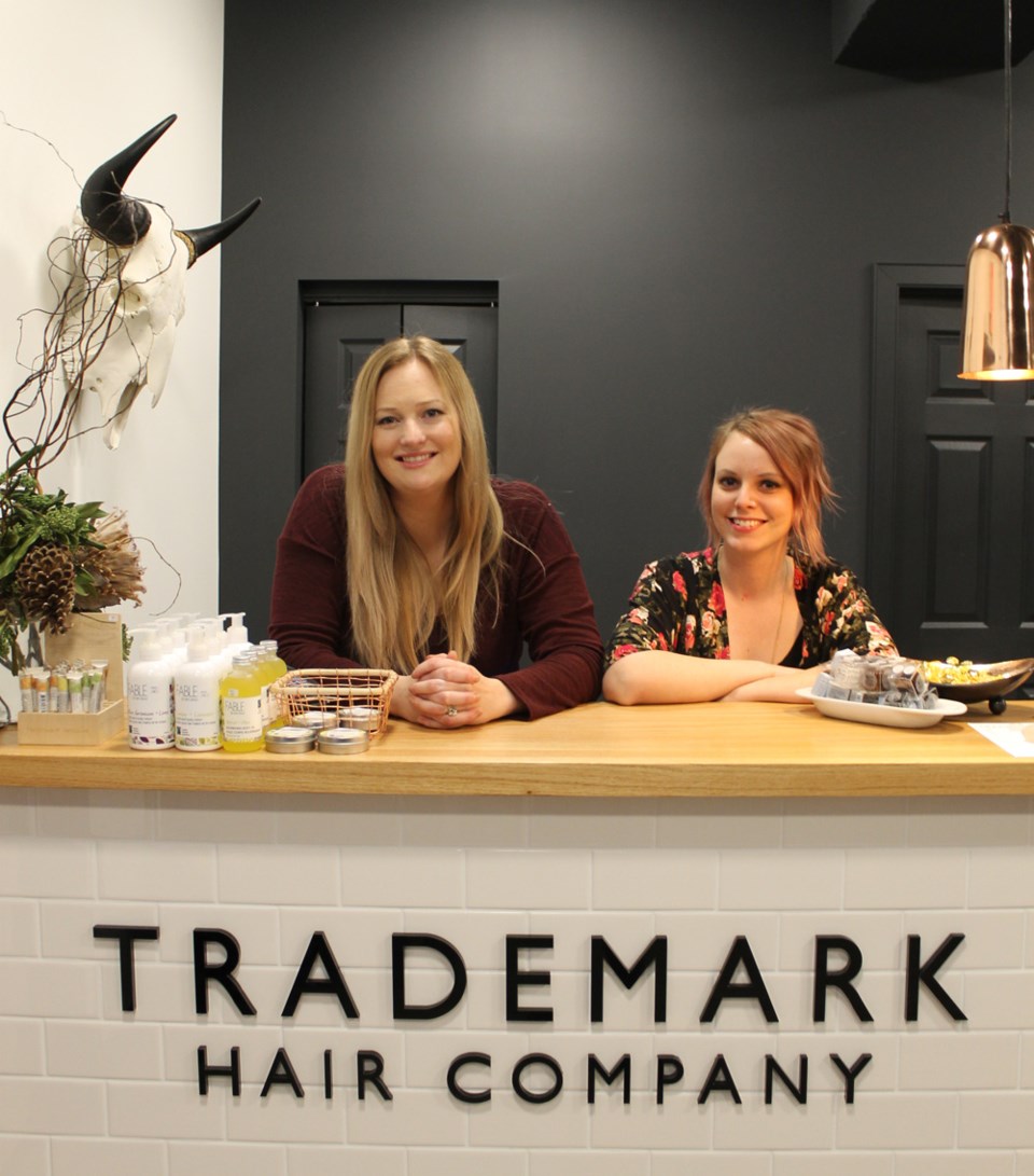 Cara Zazelenchuk (left) and Heather Argueta recently joined Trademark Hair Company after Hair on Earth unexpectedly closed leaving them without a job. K. Byrne photo.