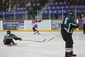 Bearcats defenseman Brendan Auger fires a slapper on net. P. Clarke photo