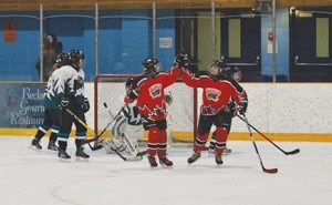 The Jasper Grizzlies scored late to tie the Grand Cache Rockies in the home team’s opening game of the Jasper Family Day tournament, Feb. 17. C. Gilbert photo.