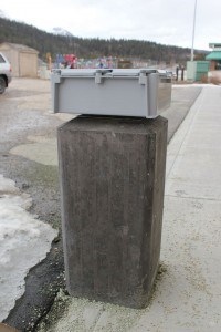 This cement block was supposed to be an electric vehicle charging station, but the company responsible for installing it went bankrupt before it could be completed. P. Clarke photo