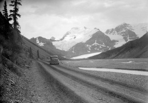 The Icefields Parkway was the first road in the world that could take people to the toe of a glacier. This photo was taken around 1940 and shows the Athabasca Glacier in the distance. Whyte Museum of the Canadian Rockies. 