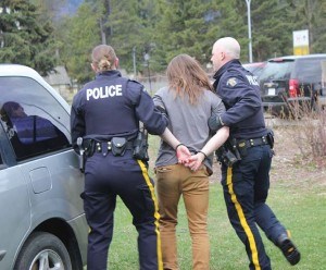 RCMP pretended to arrest the driver at the mock drinking and driving collision. P. Clarke photo.