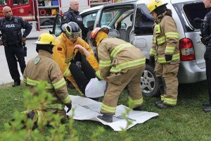 Firefighters lifted extracted one of the passengers from the car who was pronounced dead on the scene. P. Clarke.