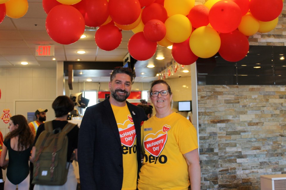 Ryan Sgro, Ronald McDonald House Charities board member and owner of the local McDonald's stores, and Brenda Casini, guest experience manager at the Hamilton Street restaurant, gear up for a busy dinner hour on McHappy Day.
