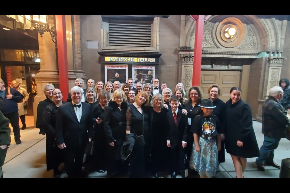 Members of the Flin Flon Community Choir, along with assembled and invited guests, pose outside of Carnegie Hall after the group's performance there Nov. 13. The singers joined choirs from around the world to sing in the world premier of composer Ola Gjeilo's Twilight Mass.