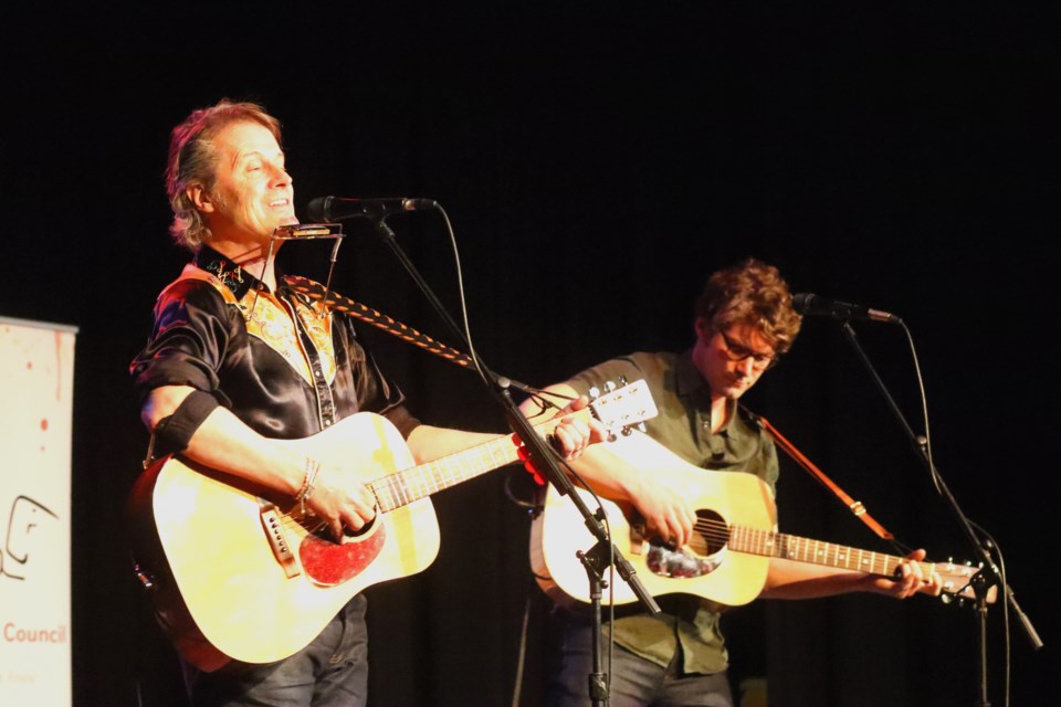 Jim Cuddy and Sam Polley strum during their Jan. 11 show at the R.H. Channing Auditorium. Cuddy, the long-time frontman of Blue Rodeo, and Polley, an accomplished musician and Cuddy's son, performed for a sold-out crowd on a night full of music from out-of-town and local sources.