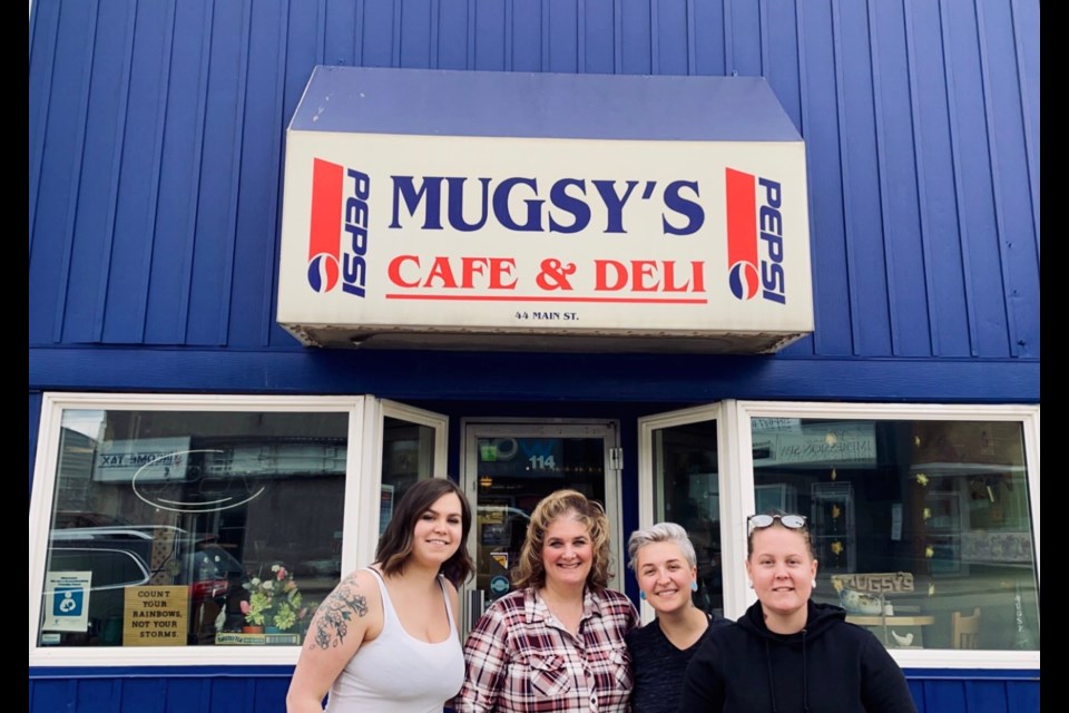 Mugsy’s Deli owner Natasha Daneliuk (second from left) stands with soon-to-be
business owners Ainslie McIntosh-Stallard, Cali Gerbrandt and Kelsie Gardner in front
of the restaurant. Mugsy’s, which has operated since 1998, has been sold and will
shut down this week.