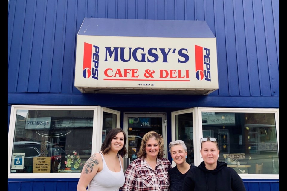 Mugsy’s Deli owner Natasha Daneliuk (second from left) stands with soon-to-be
business owners Ainslie McIntosh-Stallard, Cali Gerbrandt and Kelsie Gardner in front
of the restaurant. Mugsy’s, which has operated since 1998, has been sold and will
shut down this week.