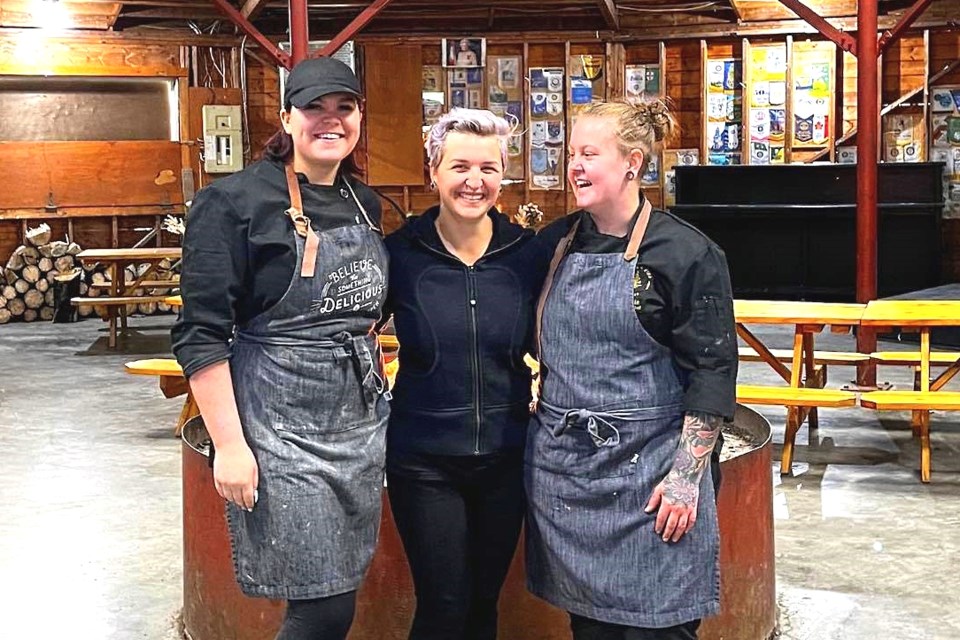 Ainslie McIntosh-Stallard, Cali Gerbrandt and Kelsie Gardner of Aurora + Pine Bistro pose after a pop-up at the Rotary Wheel June 11. The trio hope to open a new eatery on Main Street this fall.