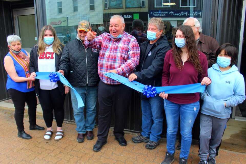 Manitoba Métis Federation (MMF) president David Chartrand and other dignitaries cut the ribbon to officially open the Flin Flon MMF suboffice May 14. The office will serve as a hub for services and programs for Métis people in Flin Flon and nearby communities.