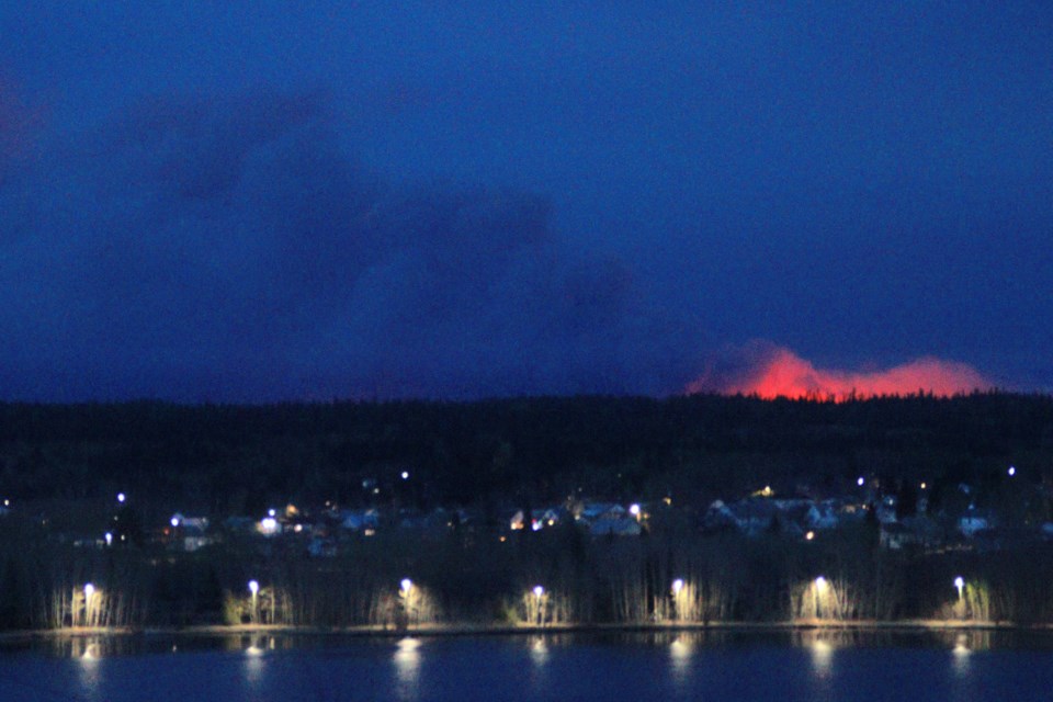 The WE010 fire near Sourdough Bay, as seen from Flin Flon over Ross Lake Sept. 10. The fire, which started after a lightning strike Sept. 9, has grown to almost 3,000 hectares in size.