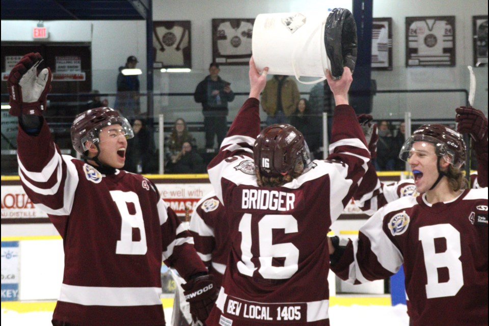 Aiden Chow, Liam Bridger and Anthony Bax celebrate Team Maroon's win in the Bombers' 3 on 3 tournament with their teammates Jan. 12.