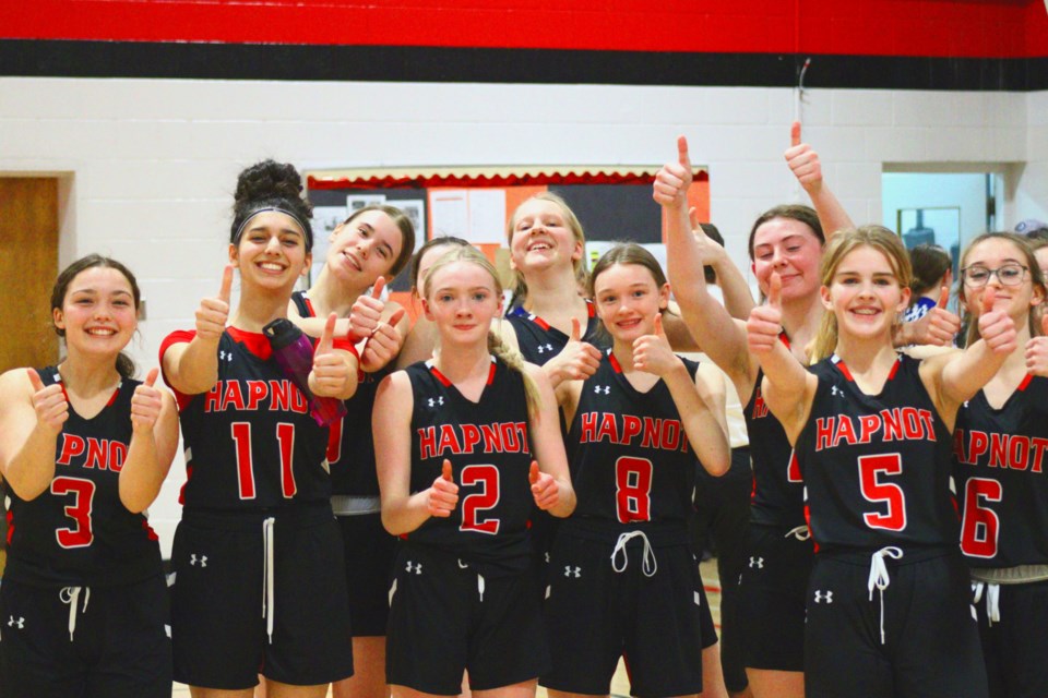 The Hapnot Kweens are all smiles and thumbs-up after defeating Frontier Collegiate at zones earlier this month.