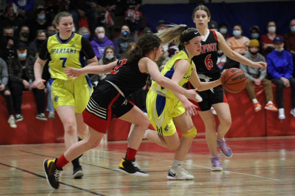 Hapnot Kweens player Shanti Church tries to guard MBCI's Shayla Godin during the girls' zone final game March 5. The hosts would come up short in the final, losing 60-49.