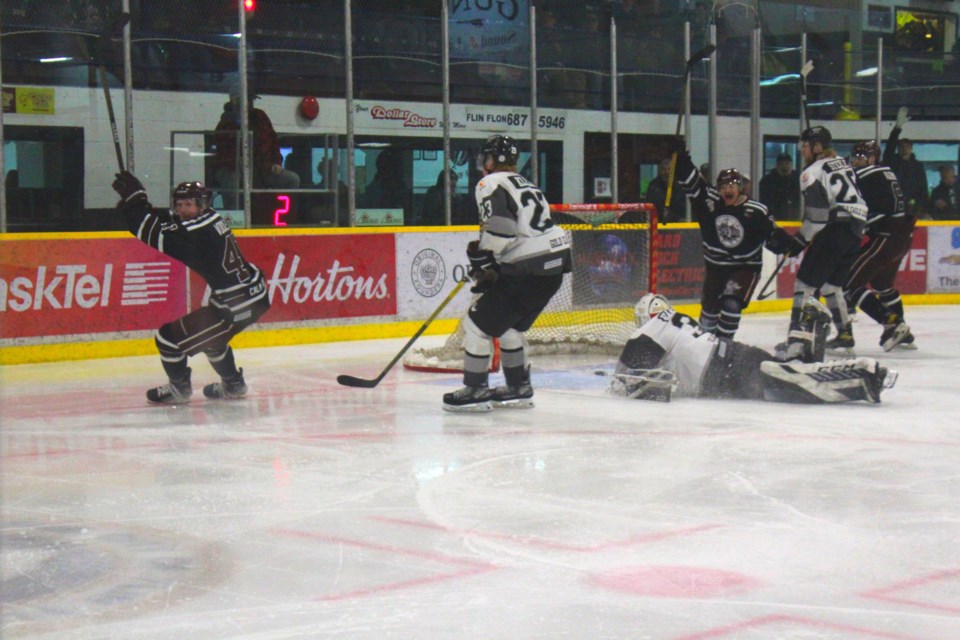 Jacob Vockler celebrates (along with Gabriel Shipper, right) after the overtime winner.