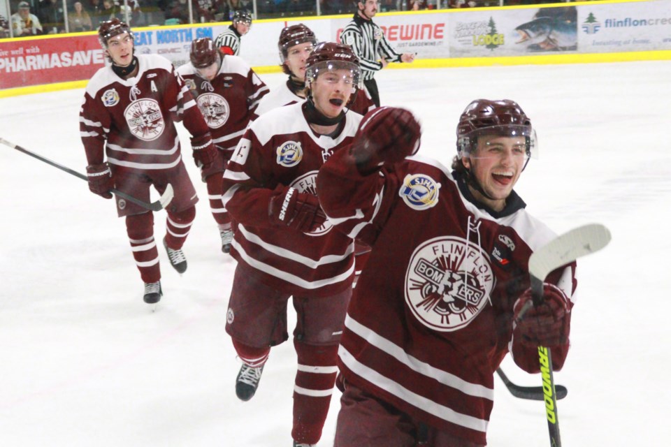 Kylynn Olafson (right) and his teammates celebrate his goal against Kindersley in Game 2 March 23.