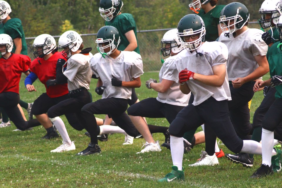 Members of the Creighton Kodiaks football team stretch out during a practice at the Oval of Dreams Sept. 4. The team opens their season with their home opener against Rosthern Sept. 14.