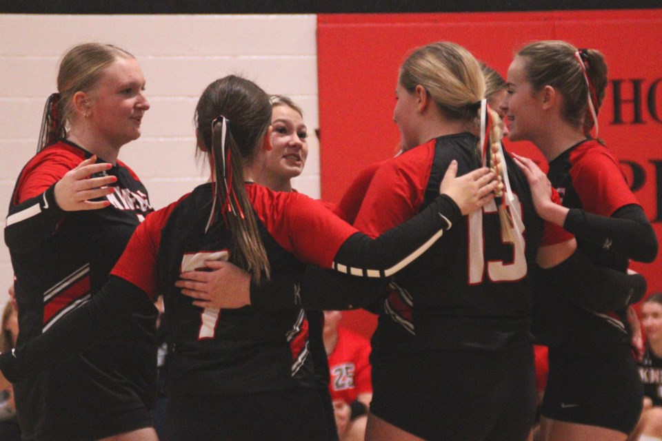 Members of the Hapnot junior varsity Kweens celebrate winning their home tournament Nov. 3.