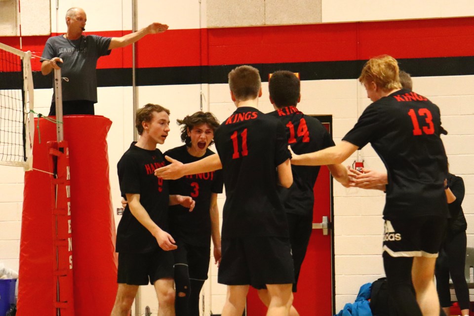 Hapnot senior Kings players celebrate their tournament-winning point during the Zone 11 championship game Nov. 19.
