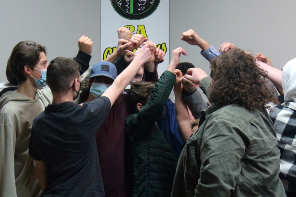Kodiaks players raise their hands together in salute during the team's awards banquet Nov. 24.