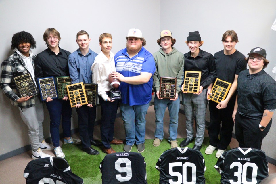 Creighton Kodiaks football team award winners pose with their hardware - from left are Payton Pelletier, Rogan Hlady, Josh Trumbley, Ethan Lavis, Bodyn Simon, Jordan Donaghy, Matthew Lavis, Ashton Burden and Kaleb Lycan.