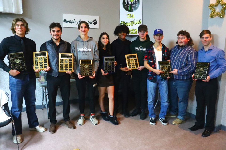 Kodiaks team award winners - Jordan Gorrell, Marcus Kennedy, Taylan Woods, Grace Dubinak, Payton Pelletier, Aidan Joa-Hall, Brayden Eyres, Jaxon Smith and Carson Straile - pose with their bounty at the team's awards banquet Nov. 30.
